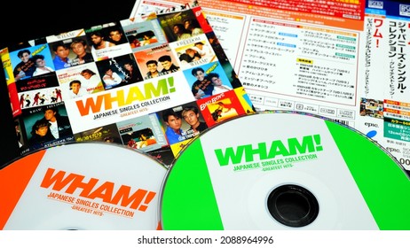 Rome, 08 December 2021: Special Japanese cd edition of the best of the English duo WHAM. first pop star group GEORGE MICHAEL. (selective focus on green cd cover)
