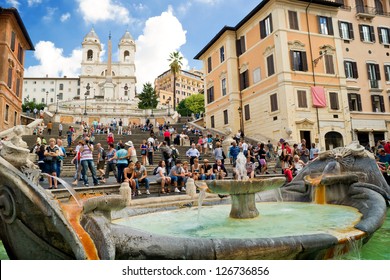 ROME - CIRCA OCTOBER 2012: The Spanish Steps, seen from Piazza di Spagna with the Fountain Barcaccia in Rome. Spanish Steps are the widest staircase in Europe. Tourists visit Spanish Steps in summer.