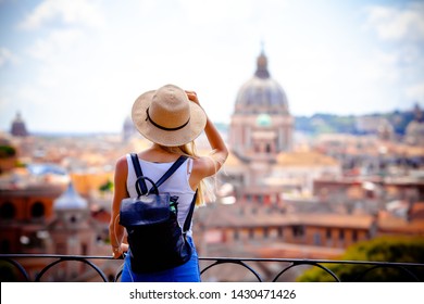 Rome Europe Italia travel summer tourism holiday vacation background -young smiling girl with mobile phone camera and map in hand standing on the hill looking on the cathedral Vatican - Shutterstock ID 1430471426