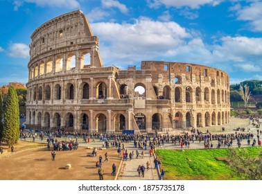 Rome, Italy - 3 December 2019 - The archeological ruins in historic center of Rome, named Imperial Fora. Here the awesome roman amphitheatre named Colosseum (Colosseo in italian language)