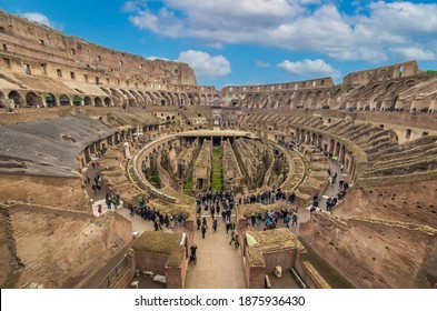 Rome, Italy - 3 December 2019 - The archeological ruins in historic center of Rome, named Imperial Fora. Here the awesome roman amphitheatre named Colosseum (Colosseo in italian language)