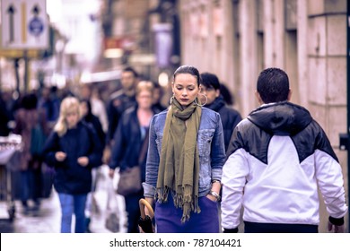 Rome, Italy. April 07, 2012.  Pensively And Alone Woman In The Crowd