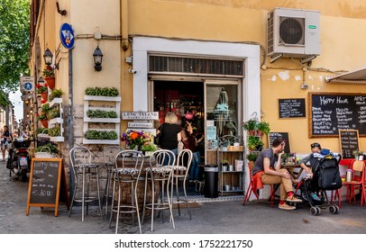 ROME, ITALY - APRIL 29, 2018 : Unidentified People At Street Restaurant In Trastevere  Area Of Rome, Italy.