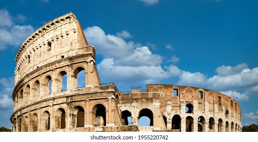 Rome, Italy. Arches archictecture of Colosseum (Colosseo) exterior with blue sky background and clouds.
