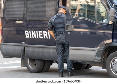 Rome, Italy - August 10, 2018: Back Turned Italian Carabiniere Near The Truck. The Carabinieri Is A Military Force Charged With Police Duties