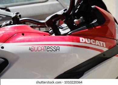 Rome, Italy - August 13, 2017: Ducati Logo On Red And White Motorbike. Ducati Motor Holding S.p.A. Is An Italian Company That Designs And Manufactures Motorcycles