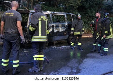 Rome, Italy - August 9, 2018: Firefighters at work extinguishing a van fire