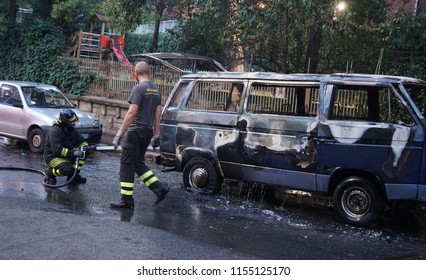 Rome, Italy - August 9, 2018: Firefighters at work extinguishing a van fire