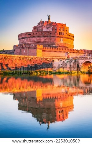 Rome, Italy. Castel Sant'Angelo sunrise water reflection in Tiber River, Roman Empire architecture. Travel sight of ancient Roma.