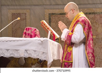 ROME, ITALY - CIRCA JANUARY 2016 - A priest saying the traditional extraordinary tridentine latin rite of the Catholic mass in the basilica of St Nicholas in Rome