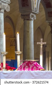 ROME, ITALY - CIRCA JANUARY 2016 - Altar with chalice covered in red brocadel during a traditional extraordinary old latin rite Mass in the basilica of St Nicholas in Rome