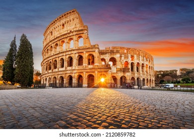 Rome, Italy at the Colosseum Amphitheater with the sunrise through the entranceway.  - Shutterstock ID 2120859782
