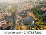 Rome, Italy. Colosseum - A monumental three-level Roman amphitheater where gladiator fights took place. Panorama of the city on a summer morning. Aerial view