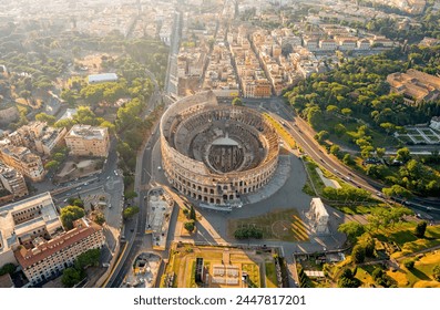 Rome, Italy. Colosseum - A monumental three-level Roman amphitheater where gladiator fights took place. Panorama of the city on a summer morning. Aerial view - Powered by Shutterstock