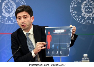 Rome, Italy - January 10, 2022: Roberto Speranza, Italy’s Health Minister, Shows A Graphic During A News Conference On A Vaccine Mandate.
