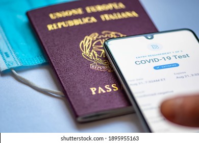 Rome, Italy, - January 17 2021: Covid Test Requirements And Procedures Covid-19 Immunity Health Pass App. Vaccine Certificate Or Passport App Displayed An A Smartphone With Passport And Facial Mask