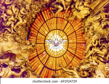 ROME, ITALY - JANUARY 18, 2017 Throne Bernini Holy Spirit Dove Saint Peter's Basilica Vatican Rome Italy.  Bernini created Saint Peter's Throne with Holy Spirit Dove Stained Glass Amber in 1600s
