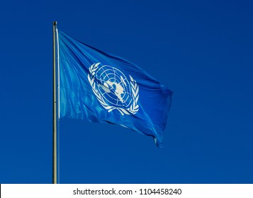 ROME, ITALY - JANUARY 21, 2018: United Nations flag fluttering in the wind, with blue sky