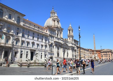 ROME, ITALY - JULY 16, 2017: Tourists At Piazza Navona In Rome, Italy. Piazza Navona Is Popular Destination In Rome    Fountain Of The Four Rivers And SantAgnese In Agone On Navona Square, Rome, Italy