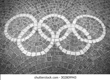 ROME, ITALY - JULY, 2012: Decorative Olympic Rings Logo Set In Stone Blocks At The Foro Italico Sports Complex. 