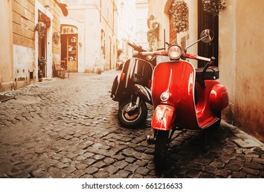 Rome, Italy - July 8, 2014: Two Scooter Vespa parked on old street in Rome, Italy