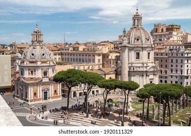 ROME, ITALY - JUNE 1, 2019: Church of Saint Mary of Loreto, Church of the Most Holy Name of Mary and Trajan's Column with a statue of St. Peter in Trajan Forum.