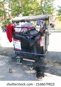 Rome, Italy - June 16, 2022, Detail Of A Fire Damaged Garbage Can.