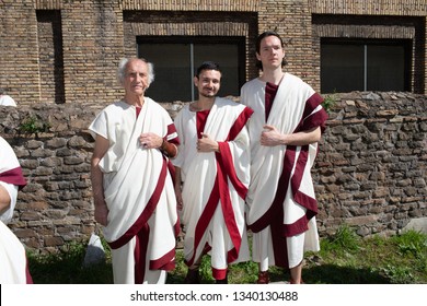 Rome, Italy – March 15, 2019: At the Sacred Area of Largo Argentina, with the occasion of the Ides of March, a group of reenactors of the Roman Historical Group playing the role of roman senators.