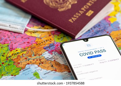 Rome, Italy, - March 17 2021: Green Or Covid Pass. EU Digital Certificate Covid-19. Covid Or Coronavirus Vaccine Certificate, Passport App With Passport, Mask And Map Of Europe