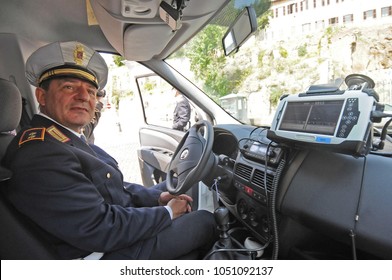 Rome, Italy - March 21st, 2018: A Local Police Officer Sitting Inside His Car Controlling The Traffic In Rome 