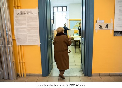 Rome, Italy - March 4 2018: A Voter Enters A Polling Station  To Cast Their Ballot During Italian General Election In Rome.