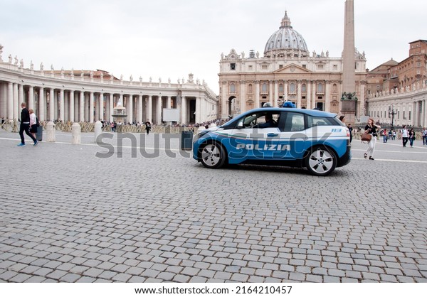 Rome,\
Italy - May 02, 2018: Police car at Saint Peters Square with Saint\
Peters Basilica of Vatican city in\
background.