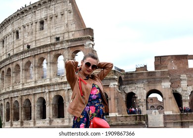 Rome, Italy - May 24, 2018:girl standing at the Colosseum, Rome, Italy - Shutterstock ID 1909867366