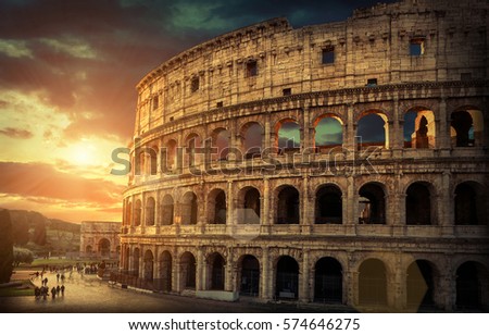 Rome, Italy.One of the most popular travel  place in world - Roman Coliseum under evening sun light and sunrise sky.