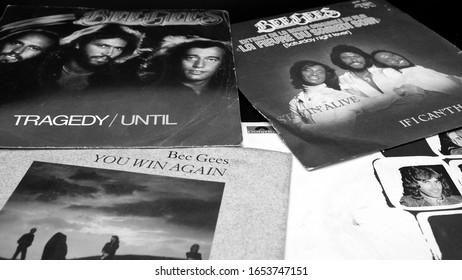 Rome, Italy - November 18, 2019: 45 rpm covers of the BEE GEES group. composed of the brothers Barry, Robin and Maurice Gibb, the most successful artists in the history of music with over 230 million
