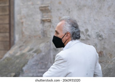 Rome, Italy - October 1, 2021: Marco Travaglio wearing a mask, Italian investigative journalist, writer and opinion leader, editor of the independent journal Il Fatto Quotidiano. Profile portrait