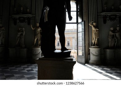 Rome, Italy - October 10, 2018: The Great Central Hall In Capitoline Museum In Rome. The Window Overlooks The Campidoglio. The Colossal Basanite Statue Depicts The Baby Hercules. 