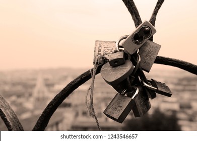 Rome, Italy - October  12, 2018: Lovers padlocks on a bridge. View from the Pincian hill in Rome, Italy
