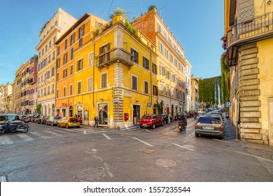 ROME, ITALY - OCTOBER 18, 2019: Sunlight Is Enlightening Cars In Street Of Rome