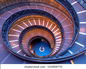 ROME, ITALY - OCTOBER 21, 2019: The Bramante Staircase is a double helix, having two staircases allowing people to ascend without meeting people descending