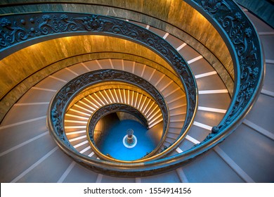 ROME, ITALY - OCTOBER 21, 2019: The Bramante Staircase is a double helix, having two staircases allowing people to ascend without meeting people descending