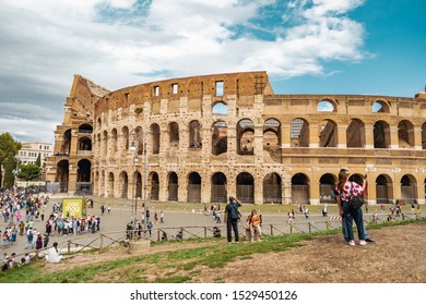Rome, Italy - October 3, 2019: Crowd Of Tourists In Front Of The Ancient Colosseum Or Coliseum, Also Known As Flavian Amphitheatre In The City.