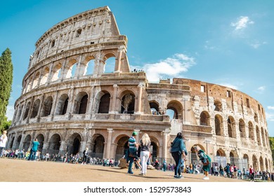 Rome, Italy - October 3, 2019: Crowd Of Tourists In Front Of The Ancient Colosseum Or Coliseum, Also Known As Flavian Amphitheatre In The City.
