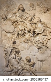 ROME, ITALY - SEPTEMBER 1, 2021: The baroque marble relief of Holy Family and blesed Ludovica Albertoni the church Chiesa di Santa Maria in Campitelli by Lorenzo Ottoni (1697-1705).