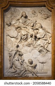 ROME, ITALY - SEPTEMBER 1, 2021: The baroque marble relief of Holy Family and blesed Ludovica Albertoni the church Chiesa di Santa Maria in Campitelli by Lorenzo Ottoni
(1697-1705).