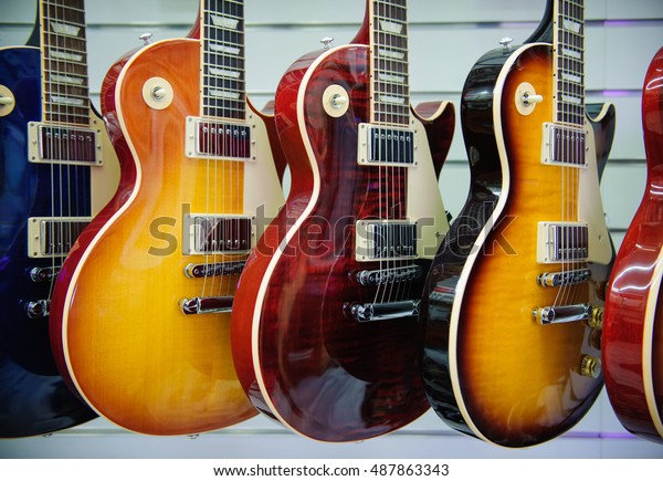 Rome,\
Italy. September 20th 2016.  Gibson Les Paul electric guitars\
sunburst color in a store showroom, body\
detail