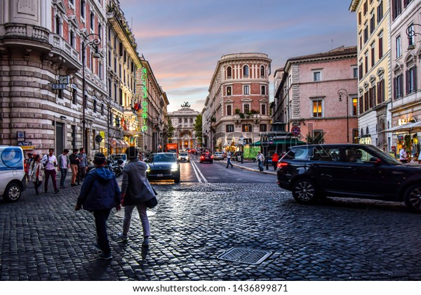 Rome, Italy - September 29\
2018: Evening approaches and the lights come on in the historical\
center of Rome, Italy, with the Palace of Justice in the distance.\
