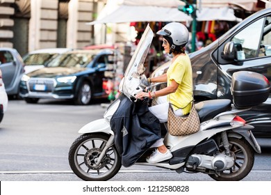 Rome, Italy - September 4, 2018: One Local Italian Woman Riding Scooter Motorcycle Moped In City Street Traffic Closeup, Happy Smiling