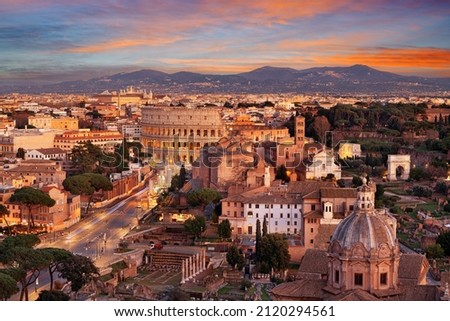 Rome, Italy view towards the Colosseum with archeological areas at sunset.