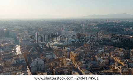 Rome, Italy. Vittoriano - Monument to the first king of Italy, Victor Emmanuel II. Flight over the city. Panorama of the city in the morning. Backlight. Summer, Aerial View  